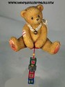 Cherished Teddies-Nolan - A String of Good Tidings - Retired 10/99